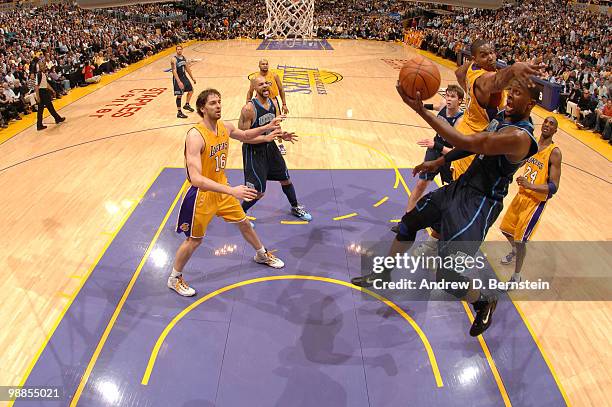 Miles of the Utah Jazz has his shot challenged by Andrew Bynum of the Los Angeles Lakers in Game Two of the Western Conference Semifinals during the...