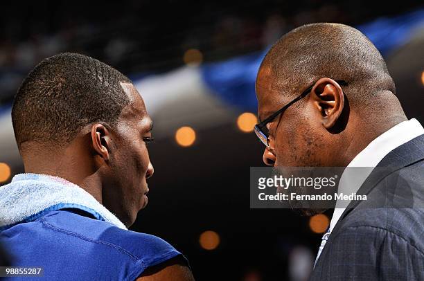 Dwight Howard listens to assistant coach Patrick Ewing of the Orlando Magic during a time out against the Atlanta Hawks in Game One of the Eastern...