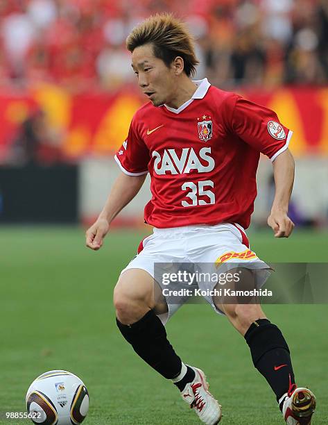 Tomoya Ugajin of Urawa Red Diamonds in action during the J. League match between Urawa Red Diamonds and Nagoya Grampus at Saitama Stadium on May 5,...