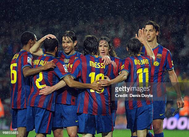Barcelona's Seydou Keita , Daniel Alves, Maxwell Scherrer , Lionel Messi, Carles Puyol , Bojan Krkic and Zlatan Ibrahimovic celebrate after Messi...