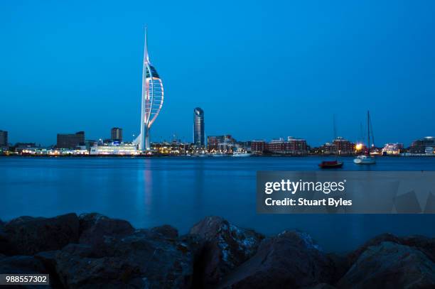 bright lights across the water - spinnaker tower stock pictures, royalty-free photos & images