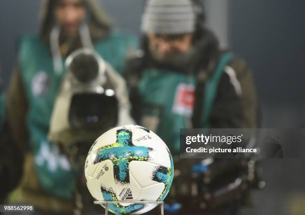 Camera person films the ball before the German Bundesliga soccer match between SC Freiburg and Hamburger SV at the Schwarzwald Stadium in Freiburg,...