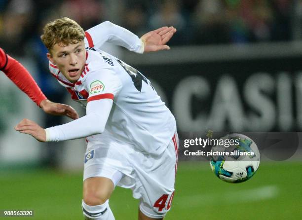 Hamburg's Jann-Fiete Arp plays the ball during the German Bundesliga soccer match between SC Freiburg and Hamburger SV at the Schwarzwald Stadium in...