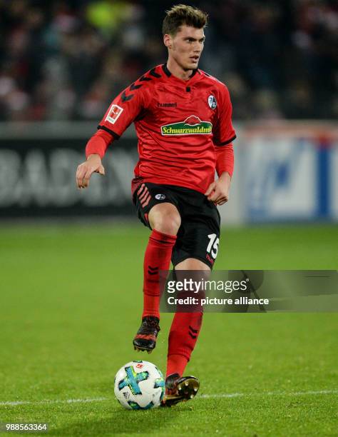 Freiburg's Pascal Stenzel plays the ball during the German Bundesliga soccer match between SC Freiburg and Hamburger SV at the Schwarzwald Stadium in...