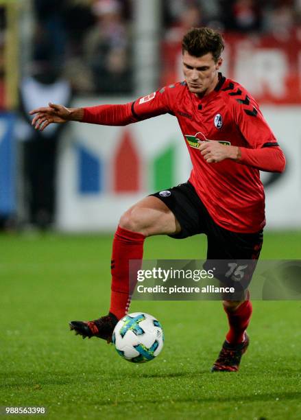 Freiburg's Pascal Stenzel plays the ball during the German Bundesliga soccer match between SC Freiburg and Hamburger SV at the Schwarzwald Stadium in...