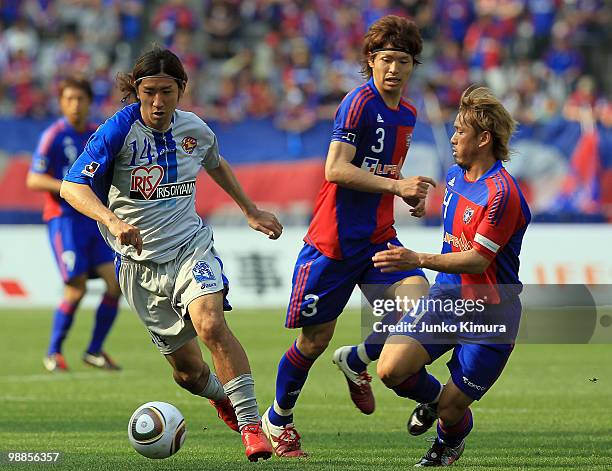 Masato Morishige of FC Tokyo and Tomoyuki Hirase of Vegalta Sendai compete for the ball during the J. League match between FC Tokyo and Vegalta...