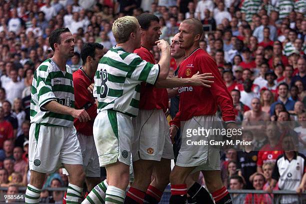 Tempers flair as David Beckham of Man Utd clashes with Neil Lennon of Celtic during the Manchester United v Celtic Ryan Giggs Testimonial match at...