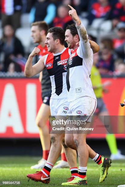 Jade Gresham and Jack Steven of the Saints celebrate a goal during the round 15 AFL match between the Melbourne Demons and the St Kilda Saints at...