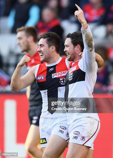 Jade Gresham and Jack Steven of the Saints celebrate a goal during the round 15 AFL match between the Melbourne Demons and the St Kilda Saints at...