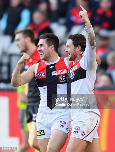 Jade Gresham and Jack Steven of the Saints celebrate a goal during the round 15 AFL match between the Melbourne Demons and the St Kilda Saints at...