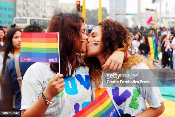 Couple of girls kissing when thousands of activists from the LGBT community and sympathizers take to the street to participate in the Lima 2018 Pride...