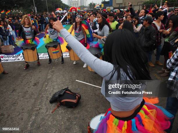Girls members of the group "Yemaya Batucada", wearing a full colored tutu, playing drums and leading the march when thousands of activists from the...