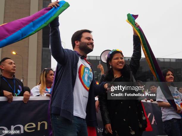 Congressman Alberto de Belaunde and Congresswoman Indira Huilca cutting the ribbon to start the Lima 2018 Pride Parade in search of recognition of...