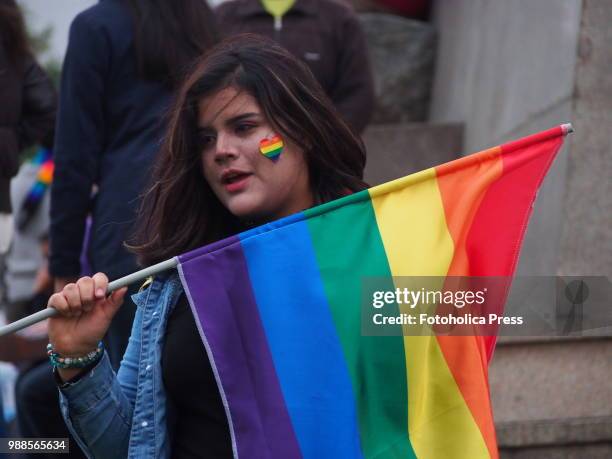 Venezuelan girl waving a gay flag when thousands of activists from the LGBT community and sympathizers take to the street to participate in the Lima...