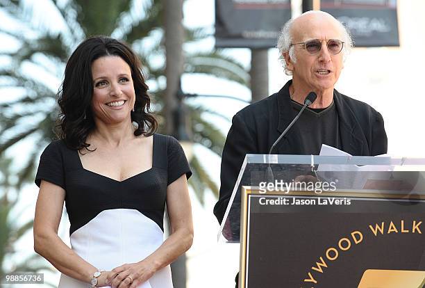 Julia Louis-Dreyfus and Larry David attend Julia Louis-Dreyfus' induction into the Hollywood Walk of Fame on May 4, 2010 in Hollywood, California.