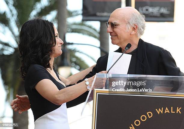 Julia Louis-Dreyfus and Larry David attend Julia Louis-Dreyfus' induction into the Hollywood Walk of Fame on May 4, 2010 in Hollywood, California.