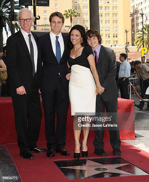 Actress Julia Louis-Dreyfus poses with her husband Brad Hall and sons Henry Hall and Charles Hall at her induction into the Hollywood Walk of Fame on...