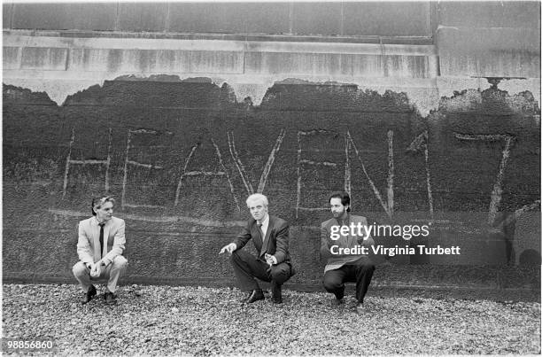 Ian Craig Marsh, Glenn Gregory and Martyn Ware of Heaven 17 pose for a group portrait in front of the band name scratched into the wall by the Thames...