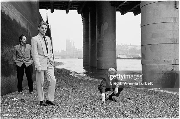 Martyn Ware, Ian Craig Marsh and Glenn Gregory of Heaven 17 pose for a group portrait session by the Thames at Embankment on March 31st 1981 in...