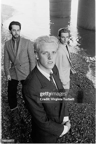 Martyn Ware, Glenn Gregory and Ian Craig Marsh of Heaven 17 pose for a group portrait session by the Thames at Embankment on March 31st 1981 in...