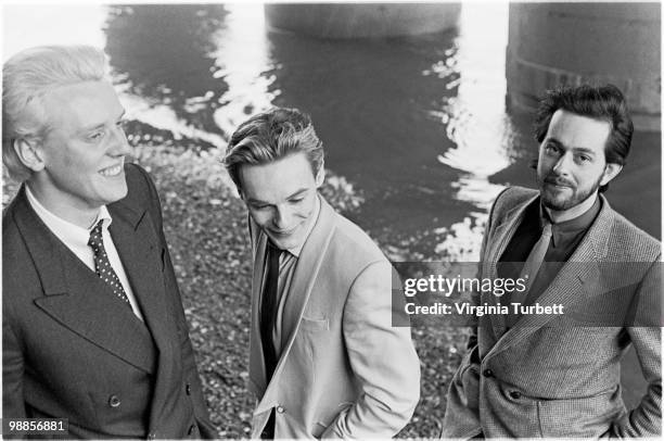 Glenn Gregory, Ian Craig Marsh and Martyn Ware of Heaven 17 pose for a group portrait session by the Thames at Embankment on March 31st 1981 in...