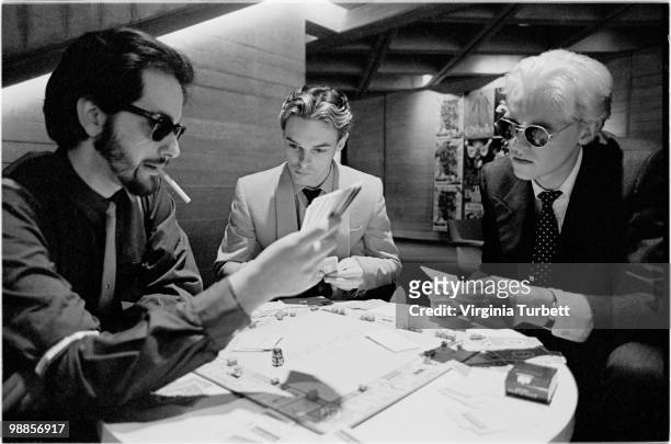 Martyn Ware, Ian Craig Marsh and Glenn Gregory of Heaven 17 play a game of Monopoly in the offices of Virgin Records on March 31st 1981 in London.