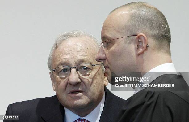 German-Canadian arms dealer Karlheinz Schreiber talks to his lawyer Jan Olaf Leisner as he waits for his verdict at court in Augsburg, southern...