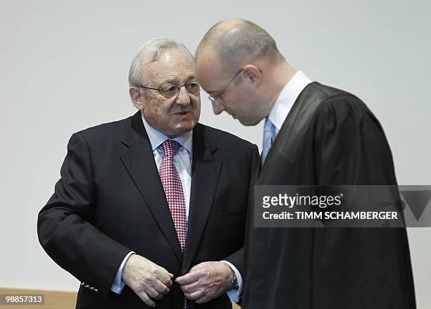 German-Canadian arms dealer Karlheinz Schreiber talks to his lawyer Jan Olaf Leisner as he waits for his verdict at court in Augsburg, southern...