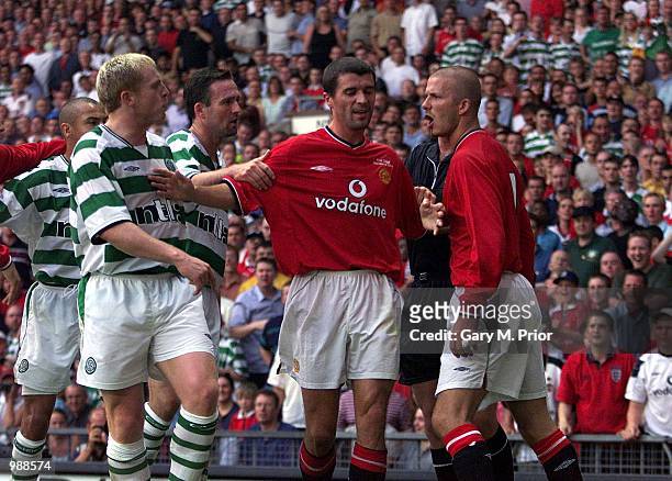 Tempers flair as David Beckham of Man Utd clashes with Neil Lennon of Celtic during the Manchester United v Celtic Ryan Giggs Testimonial match at...