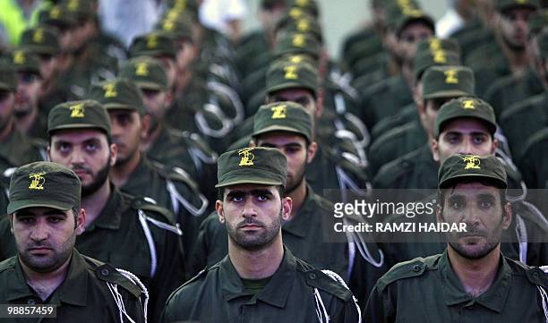 Lebanese Hezbollah members take part in a rally marking Quds Day in Beirut on September 18, 2009. Quds Day, held each year on the last Friday of the...