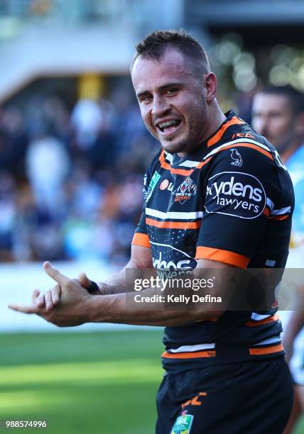 Josh Reynolds of the Tigers celebrates his try during the round 16 NRL match between the Wests Tigers and the Gold Coast Titans at Leichhardt Oval on...