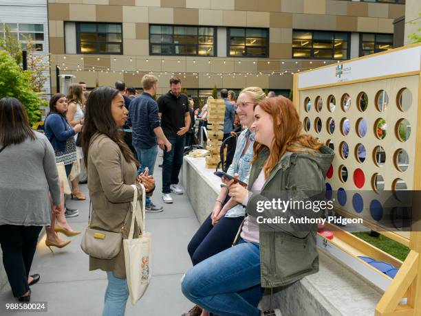 Guests enjoying the Grand Opening Event, EVEN Hotel and Staybridge Suites Seattle on June 28, 2018 in Seattle, Washington.