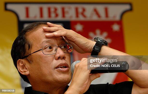 Liberal Party standard bearer Benigno 'Noynoy' Aquino , son of democracy icon Corazon Aquino, gestures during a press conference in Quezon City, east...