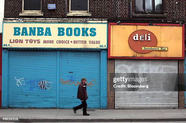 Pedestrian walks past buildings in Dublin, Ireland, on Tuesday, May 4, 2010. European Union Economic and Monetary Affairs Commissioner Olli Rehn said...