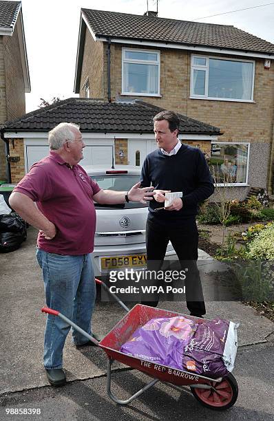Conservative party Leader David Cameron speaks with a member of the public as he canvasses potential voters on May 5, 2010 in Hucknall, England....