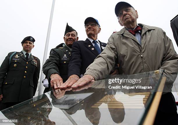 Veterans William Ryan, Charles Phallen and Murray Simon of the 3rd Infantry Division, an United States Army infantry division based at Fort Stewart,...