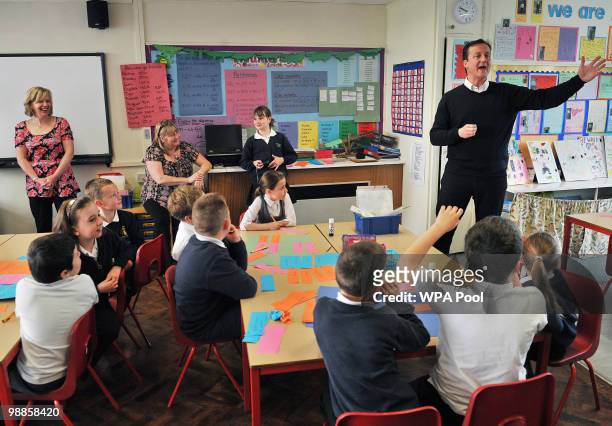 Conservative party Leader David Cameron speaks to pupils st Sir John Sherbrooke Junior School on May 5, 2010 in Calverton, England. Today is the full...