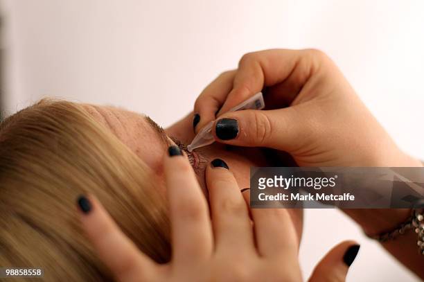 Model has eyedrops applied backstage ahead of the Karla Spetic collection show on the third day of Rosemount Australian Fashion Week Spring/Summer...