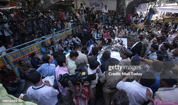 Special Prosecutor Ujjwal Nikam shows a copy of the verdict to the media outside the Arthur Road Jail, where the trial of Mohammad Ajmal Kasab, the...