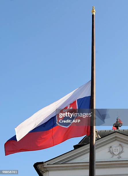 Slovakian flag flies at half mast in front of the Presidental palace in Bratislava on April 18, 2010. The bodies of Polish president Lech Kaczynski...