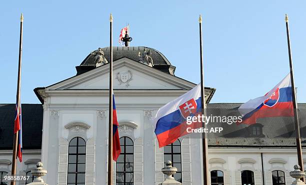 Slovakian flags fly at half mast in front of the Presidental palace in Bratislava on April 18, 2010. The bodies of Polish president Lech Kaczynski...