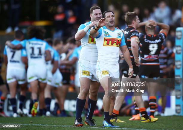 Brenko Lee and Michael Gordon of the Titans celebrate their final try during the round 16 NRL match between the Wests Tigers and the Gold Coast...