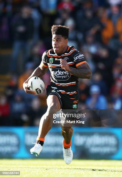 Kevin Naiqama of the Tigers makes a break during the round 16 NRL match between the Wests Tigers and the Gold Coast Titans at Leichhardt Oval on July...