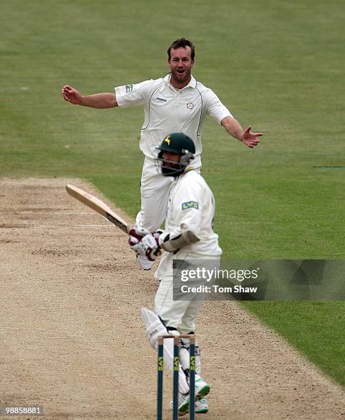 Sean Ervine of Hampshire celebrates taking the wicket of Hashim Amla of Nottinghamshire during the LV County Championship match between Hampshire and...