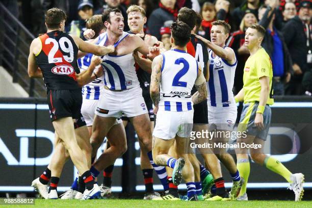 Melee breaks out at half time during the round 15 AFL match between the Essendon Bombers and the North Melbourne Kangaroos at Etihad Stadium on July...
