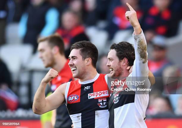 Jade Gresham and Jack Steven of the Saints celebrate a goal during the round 15 AFL match between the Melbourne Demons and the St Kilda Saints at...
