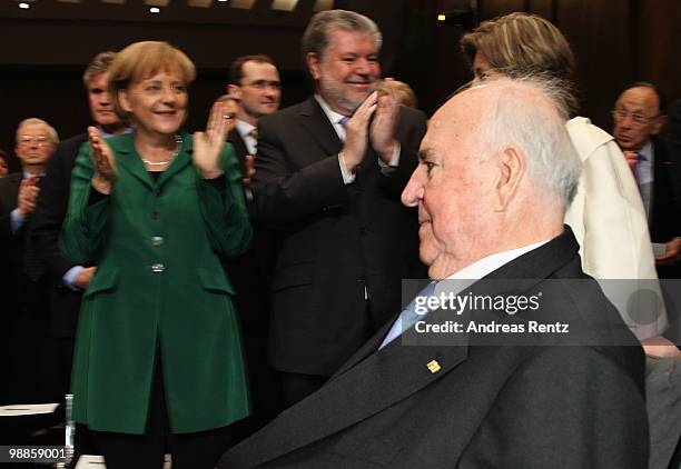 Former German Chancellor Helmut Kohl arrives as German Chancellor Angela Merkel and Kurt Beck , governor of the German federal state of...