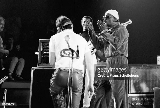 Miles Davis performs live on stage at Concertgebouw in Amsterdam, Netherlands on April 30 1982. Behind are sax player Bill Evans and bassist Marcus...