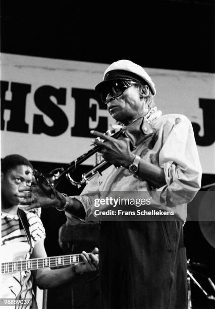 Miles Davis performs live on stage at the North Sea Jazz festival at the Hague, Holland on July 10 1984. Darryll Jones behind on bass