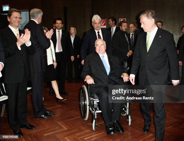 Former German Chancellor Helmut Kohl arrives with German President Horst Koehler as Vice Chancellor and Foreign Minister Guido Westerwelle applause...